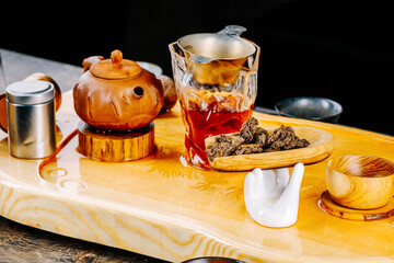 Chinese Pu-erh tea on a wooden stand. Tea ceremony