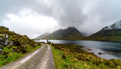 Serene lake view, misty mountains, winding road