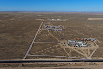 An industrial quarry in a semi-desert area. Mining of various rocks. The view from the drone.
