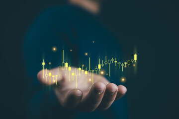 Financial trading and stock market analysis concept with glowing candlestick businessman hand, symbolizing investment, profit growth, cryptocurrency, forex, and economic strategy business growth