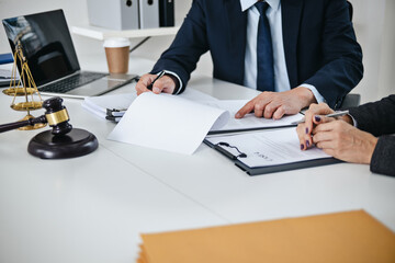 Attorney consulting on legal matters in law firm office