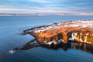 Aerial View of Coastal Cliffs and Settlement