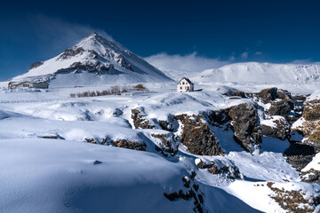 Snow-Covered Mountain with Isolated House