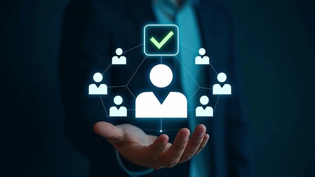 Digital Human Resource Management: Hand holding glowing network of people icons with green checkmark, symbolizing team selection, approval, or cand...