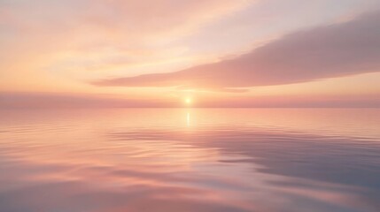 Obraz premium 53.A peaceful sunrise over a vast expanse of water, where the sky is painted in gentle pink and golden tones. The reflection on the water is nearly flawless, slightly rippled by a soft morning