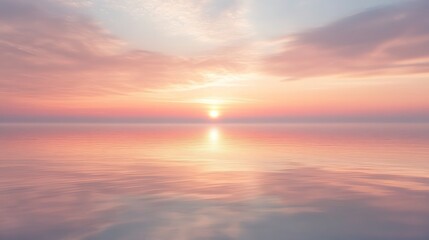Fototapeta premium 53.A peaceful sunrise over a vast expanse of water, where the sky is painted in gentle pink and golden tones. The reflection on the water is nearly flawless, slightly rippled by a soft morning