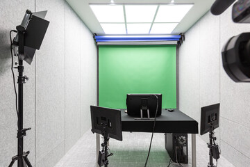 green screen studio with lighting and camera.
