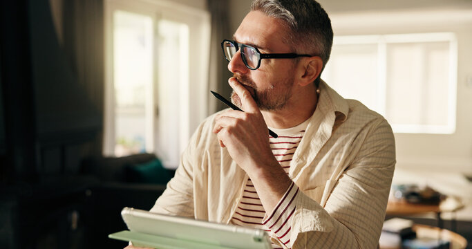 Remote work, thinking and man with tablet, pen and planning for creative project. Artist, entrepreneur and mature person with tech, decision and freelancer with ideas, home and app for online design