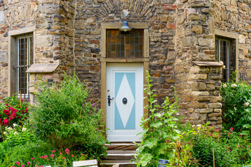 Charming Stone House Entrance with Colorful Garden in Hattingen