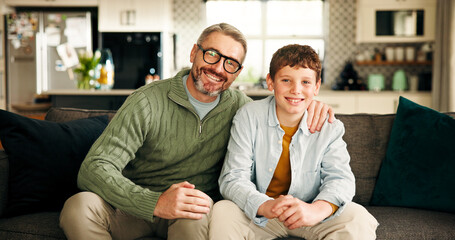 Portrait, man and bonding with child, home and affection on break in living room, happy and embrace. Family, dad and hug for son in lounge, smile and single parent with boy on weekend, love or care