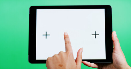 Hands, tablet and blank screen in studio with click, mock up space or ui on green background. Person, tech and user experience with scroll, point or display for interactive application with marketing