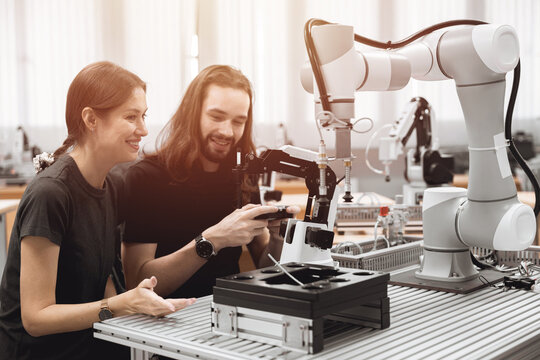 Industry engineer working people working with robot machine in modern plant factory