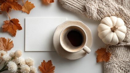 Autumnal flat lay with coffee, pumpkin, and leaves