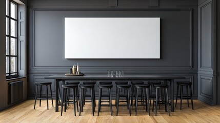 Empty black bar stools surround a long dark table in a dimly lit room.