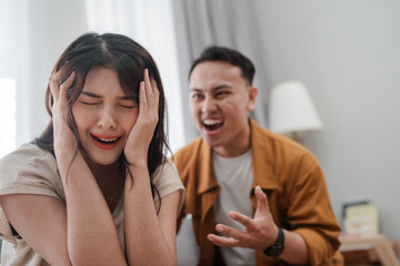 A couple is arguing, clearly showing their distress and frustration during the confrontation