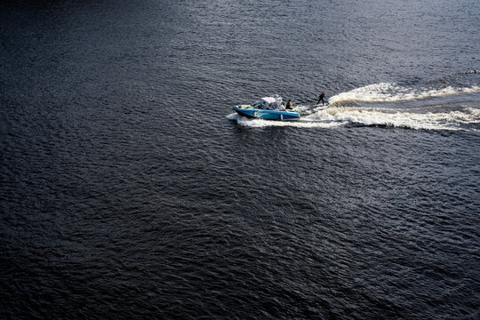 Motorboat With Water Sportsman on the Open Sea