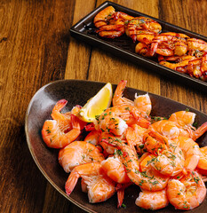 Shrimp platter with grilled shrimp on a wooden table during a dining experience