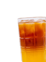 Refreshing iced tea served in a tall glass with ice cubes on a bright background