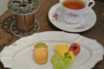 chinese afternoon tea with cake and fruit