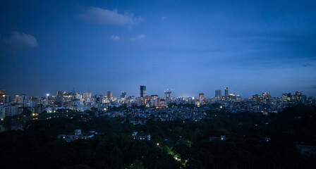 Night view at Dhaka city. Dhaka city skyline at night with glowing urban lights, beautiful modern cityscape of downtown capital, panoramic twilight view of illuminated buildings and blue evening sky