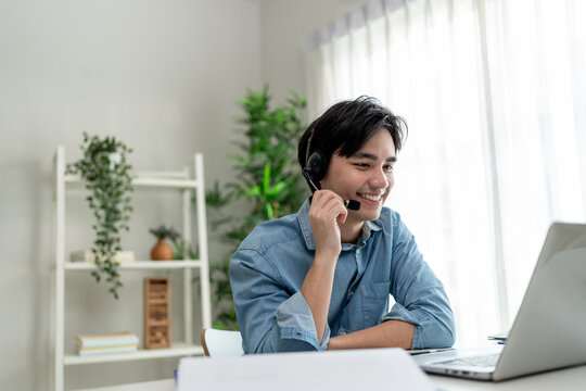 Asian young handsome man making a remote virtual video call in house. 