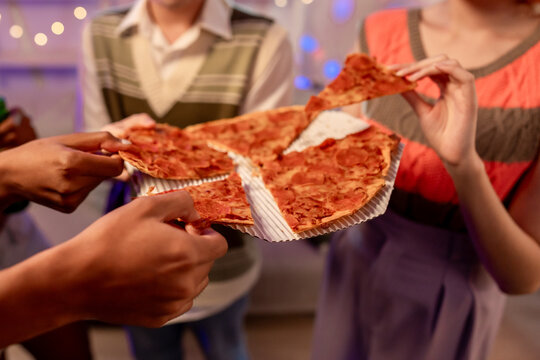 Close up of diverse Generation Z friends enjoying party in cozy house.  - Powered by Adobe