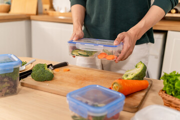 Close up of man cooking healthy foods in kitchen in morning at home. 