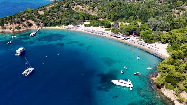 Aerial view of the popular beach at Tsougrias island, Skiathos, Sporades, Greece, excursion spot for tourists and cruises