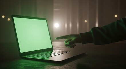 Green Screen Laptop with Hand Gesture in Dimly Lit Room