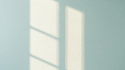 Window Light Play. Capturing the Beauty of Sunlight on a Textured Blue Wall Surface.
