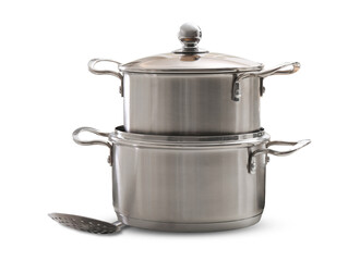 stacked stainless steel pots with lid and slotted spoon on black