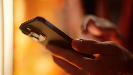 Person hand swiping on smartphone close-up