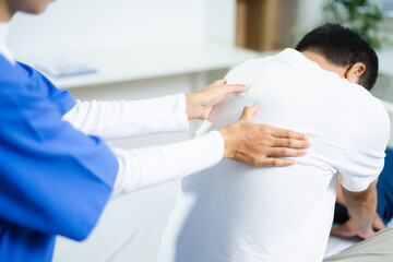 Fototapeta premium Healthcare professional assists senior man with shoulder stretch therapy. Ideal for rehab, physiotherapy, aging wellness, pain treatment, and medical care concepts.