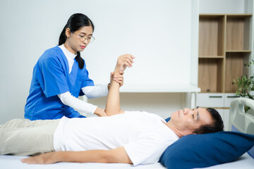 Fototapeta premium healthcare worker stretching patient’s arm in clinic. Ideal for physiotherapy, injury recovery, elder care, rehab therapy, and pain relief healthcare visuals.