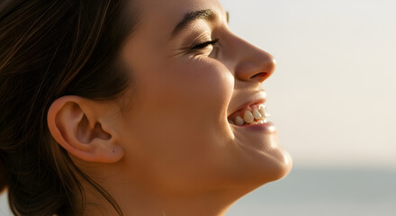 Fototapeta premium Joyful Woman Smiling at the Beach, Candid Portrait, Outdoor Setting, Natural Light, Close-Up View