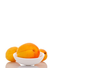 Ripe organic apricots isolated on white background, macro.