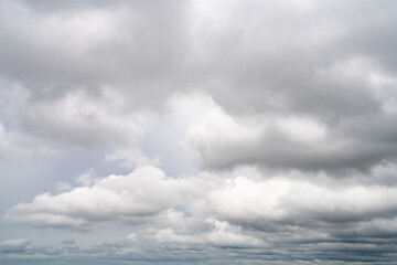 Dramatic overcast sky with gray and white clouds before rainy season storm, moody and gloomy weather background. Climate, meteorology, and atmospheric. Weather forecasting, climate change background.