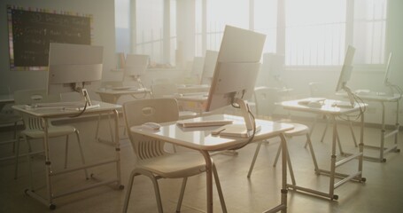High-Tech School Computer Lab with Minimalist Furniture and PC Monitors. Modern Classroom Setup Ready for Students to Practice Coding, Design, STEM Projects and Innovative Digital Learning. Dolly Shot