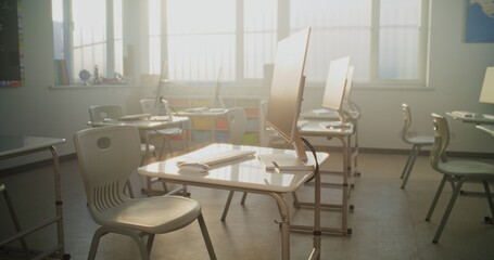 High-Tech School Computer Lab with Minimalist Furniture and PC Monitors. Modern Classroom Setup Ready for Students to Practice Coding, Design, STEM Projects and Innovative Digital Learning. Dolly Shot