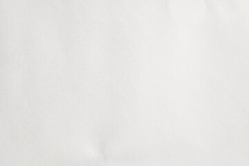 Blank white paper texture with subtle fibers and natural shadows creating a clean background.