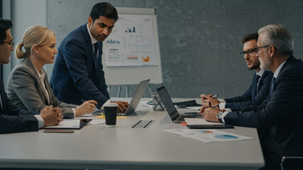 Diverse Business Team Collaborating in Modern Office Meeting