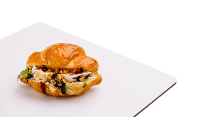 Delicious pastry filled with cheese and herbs on a white plate