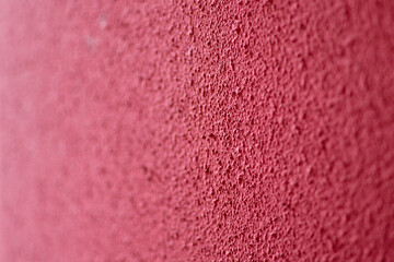 Textured Crimson Surface: An intimate close-up reveals the raw texture and dynamic character of a deep crimson surface, with an artistic focus on the tactile qualities.