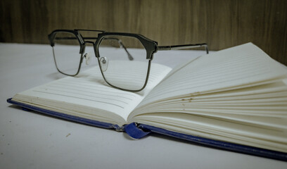 Eyeglasses on Open Notebook, Study, Vision, and Knowledge Concept