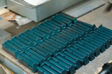 Fototapeta premium lot of neatly stacked pistol magazines, the production of weapons and ammunition