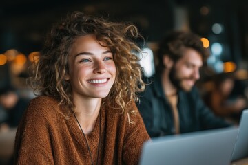 Happy young woman smiling while working in a modern cafe setting