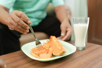 Enjoy fresh, sweet papaya slices with milk for a nutritious breakfast packed with vitamins