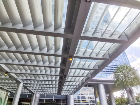 Abstract architecture featuring a modern structured ceiling with geometric patterns and building