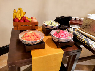Exotic fruit display at upscale buffet showcasing vibrant colors and fresh selections.
