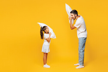 Full body young parent man with child girl wear casual blue pyjamas clothes. Daddy little kid...